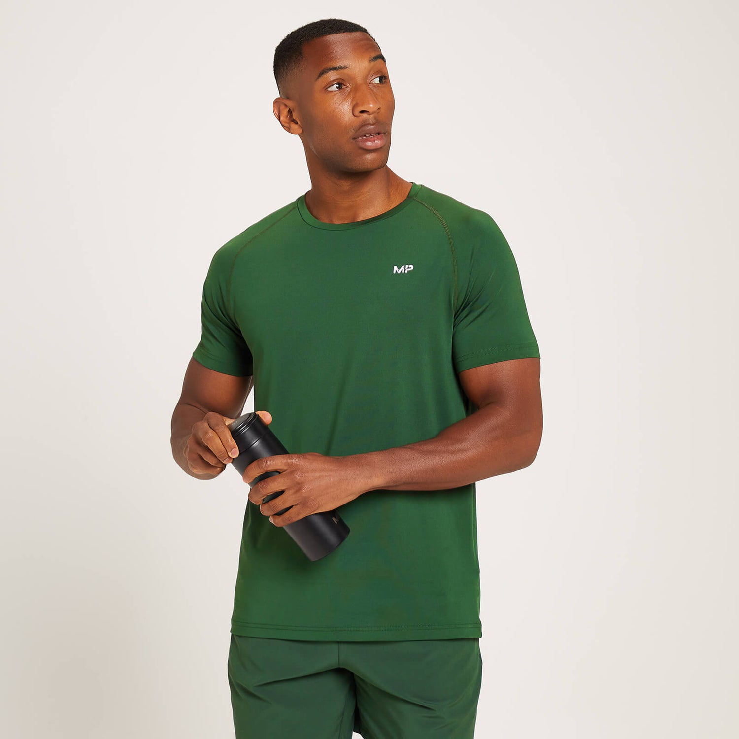 Męski T-shirt treningowy z krótkimi rękawami z kolekcji MP Linear Mark Graphic – ciemna zieleń - XS