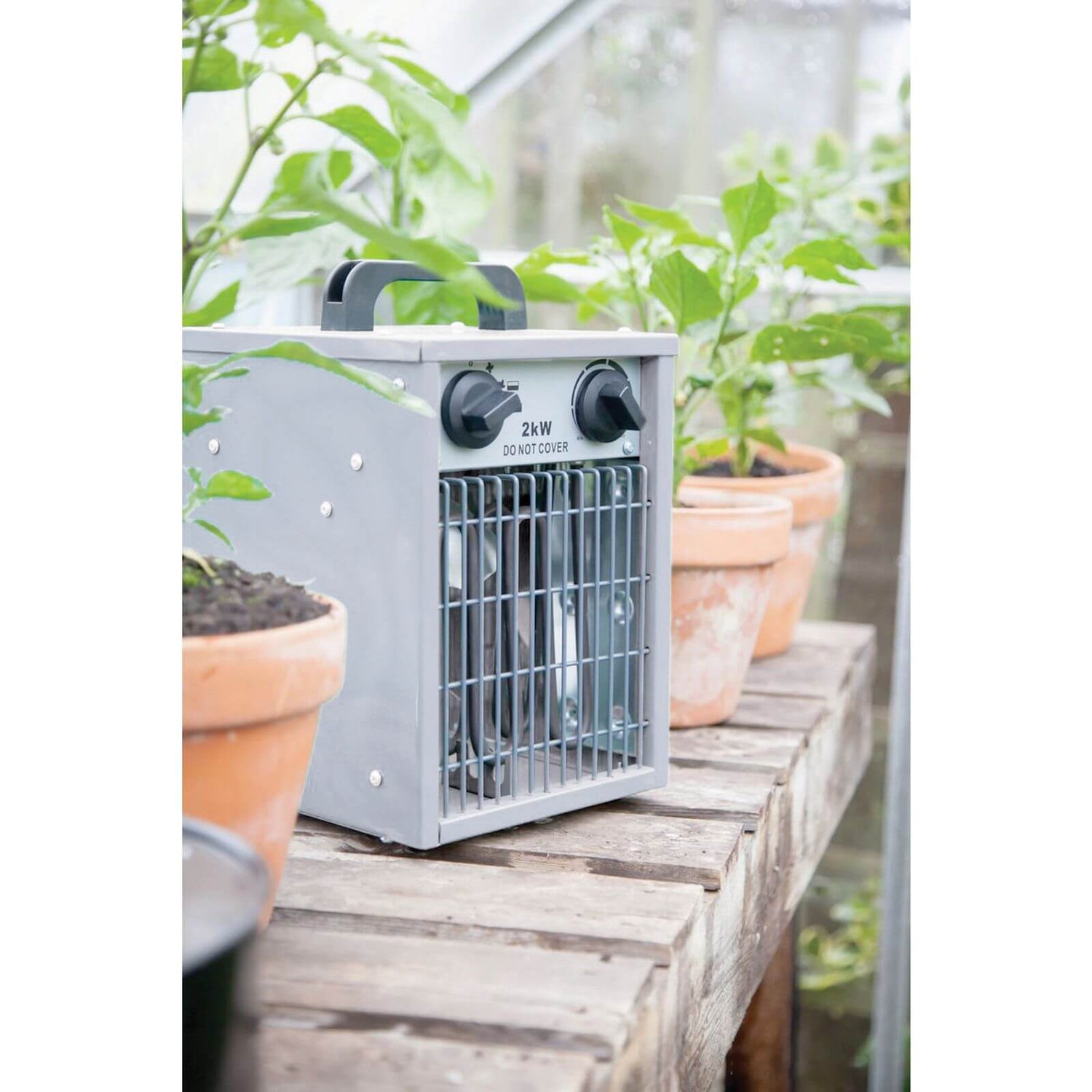 Thermostatic top greenhouse heater