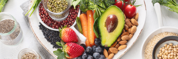 A heart-shaped plate of colourful vegan food