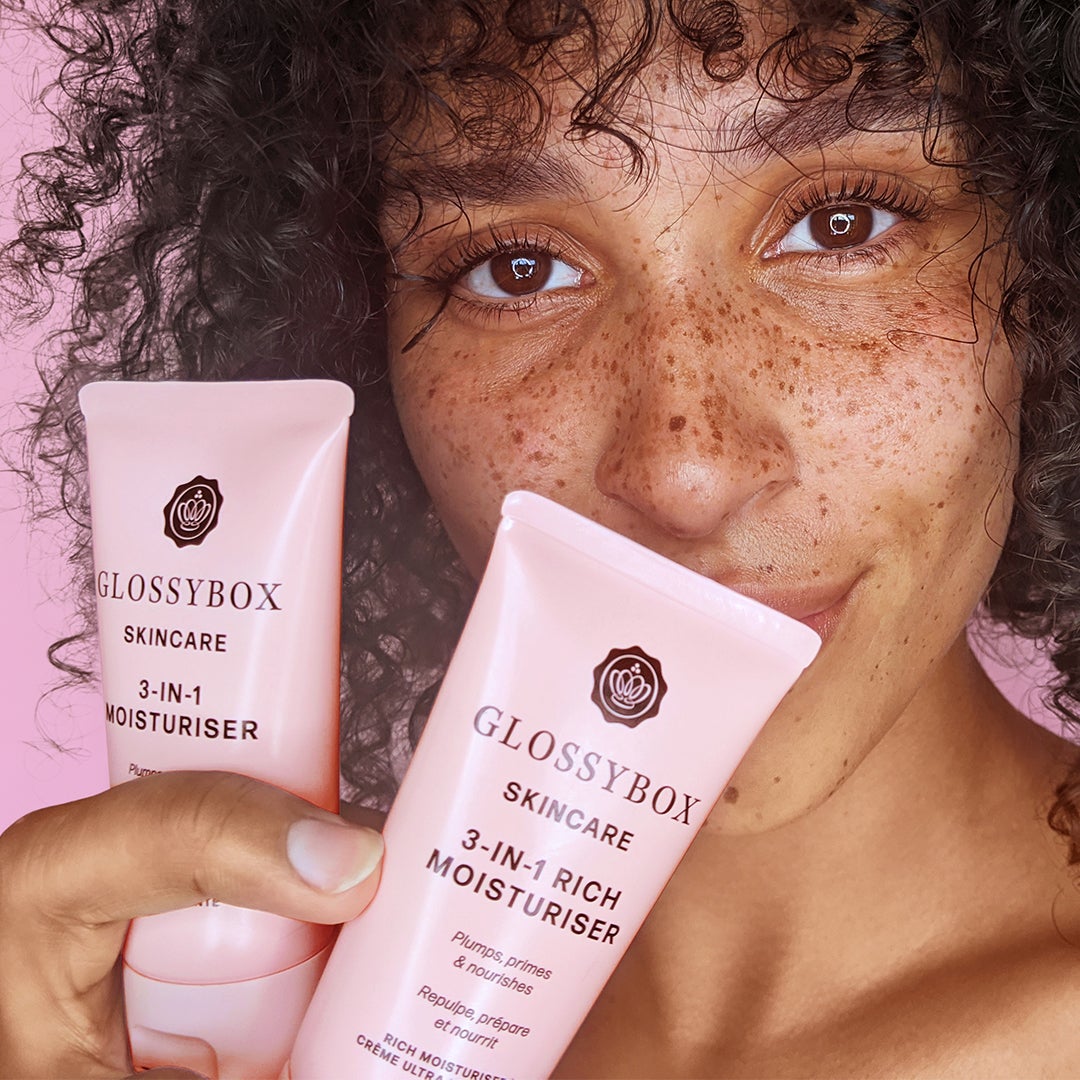 model holding glossybox skincare products