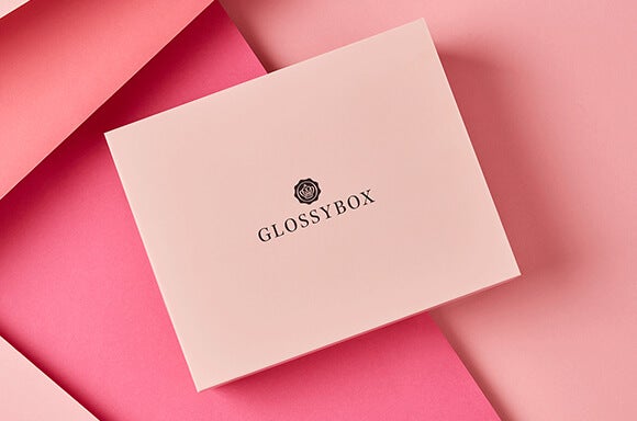 Pink GLOSSYBOX on background of various pink panels