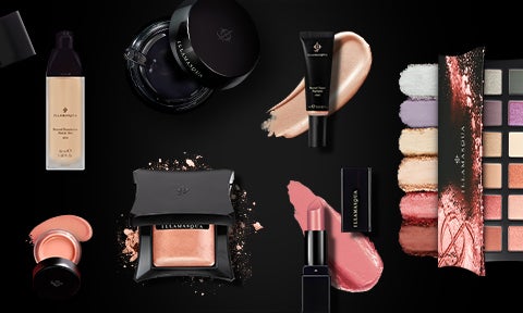 range of Illamasqua vegan makeup on black background including vegan lipstick, primer, eyeshadow palette and foundation