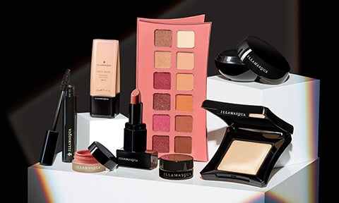 Illamasqua best selling makeup on pedestal with spotlight