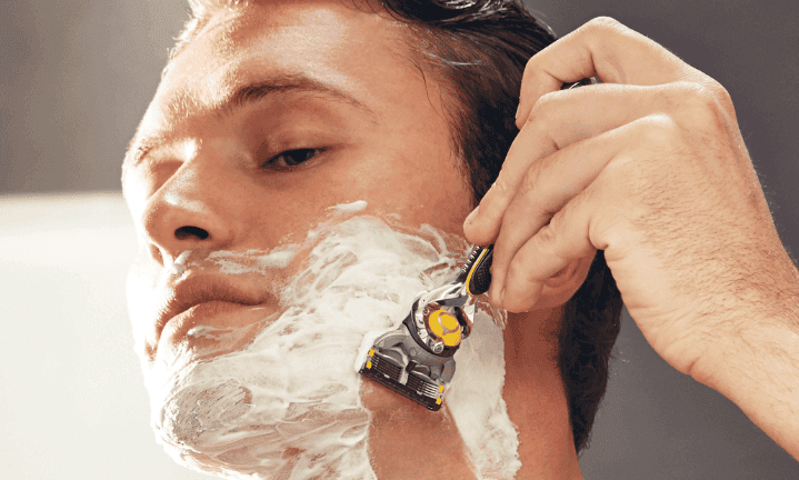 Close up man shaving with Fusion5 ProShield Razor | Gillette UK