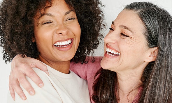 Two women smiling