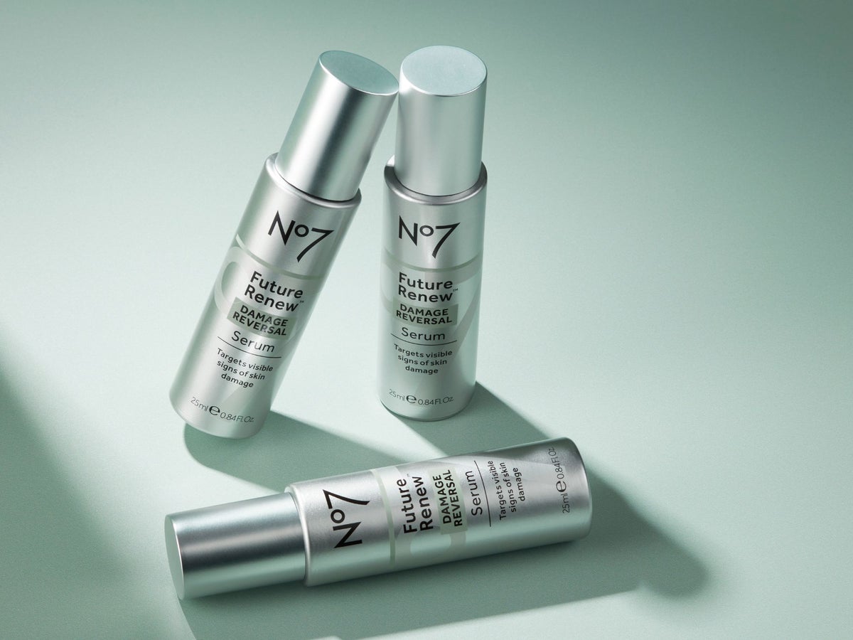 3 bottles of No7 Future Renew serum on a green background