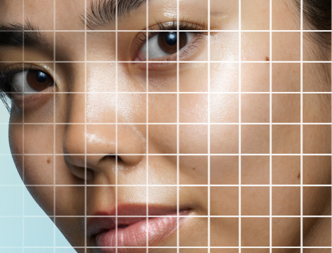Close up image of a model. White grid over the face and white dots to represent skin analysis.