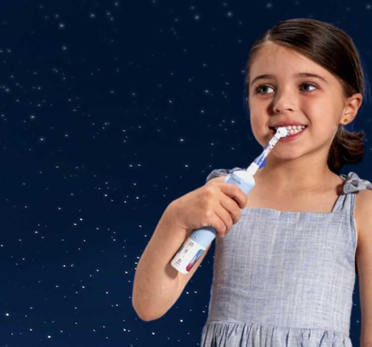 Child brushing teeth with Oral-B kids electric toothbrush