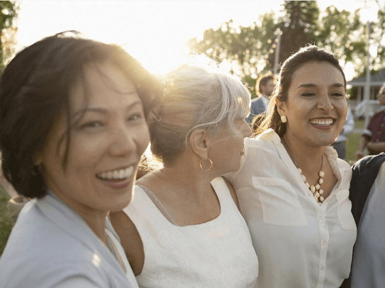 Three women smiling