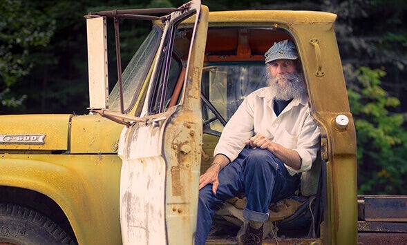 Burt smiling in a truck