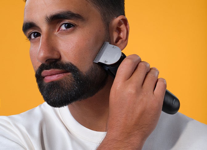 Beard styling / trimming - Braun - man using Braun 10-in-1 All-in-one Trimmer 7 MGK7220 on his beard's mustache