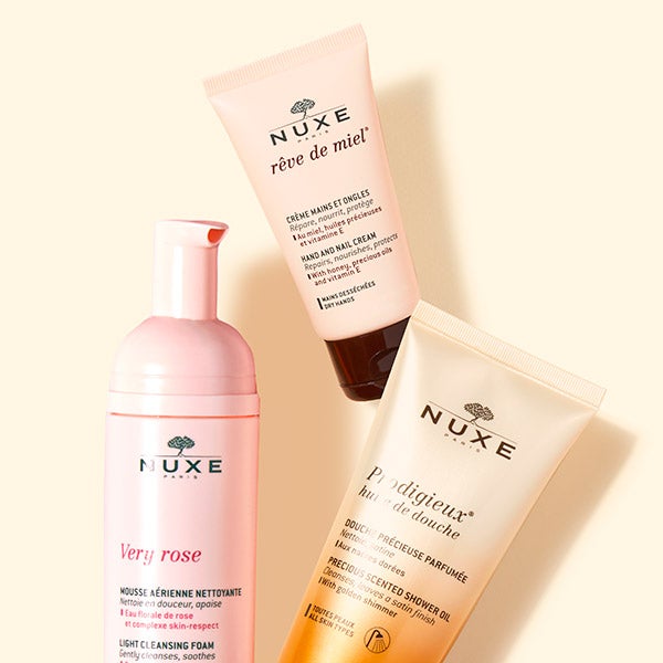 Three popular NUXE products: Prodigieux shower gel, hand and nail cream, and very rose light cleansing foam.