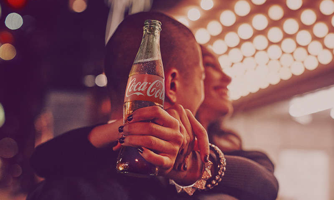 Enjoying a bottle of Coca-Cola