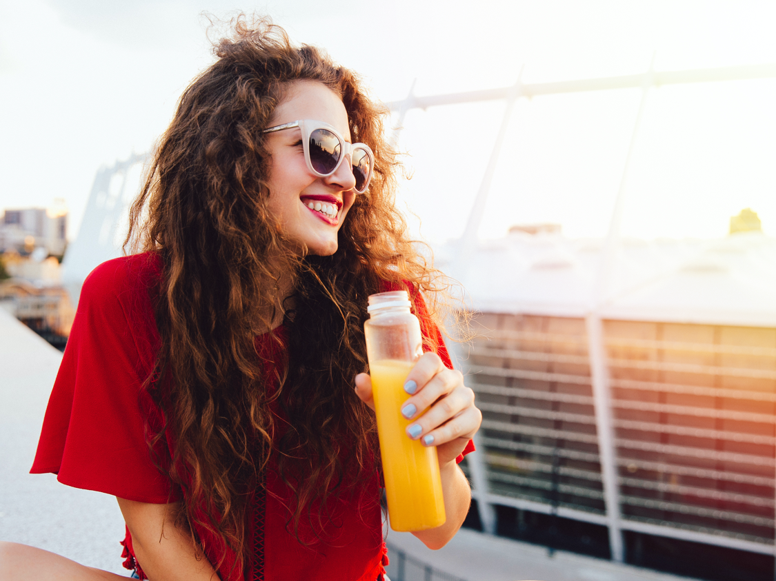 Woman enjoying a bottle of juice