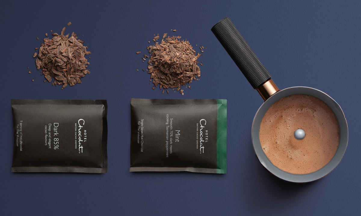 mint hot chocolate and dark hot chocolate velvetiser sachets, with a velvetiser to the right hand side