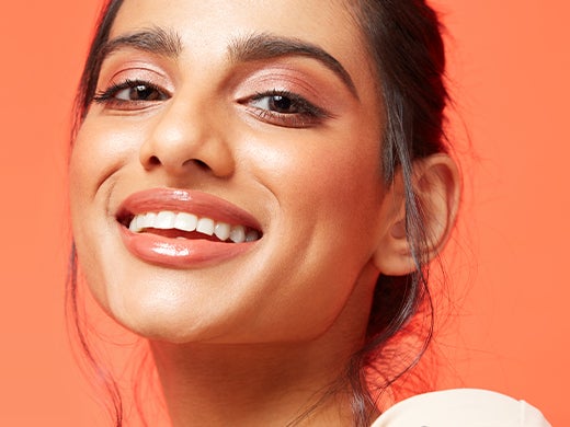 Model smiling wearing perfectly matched Note Cosmetics foundation