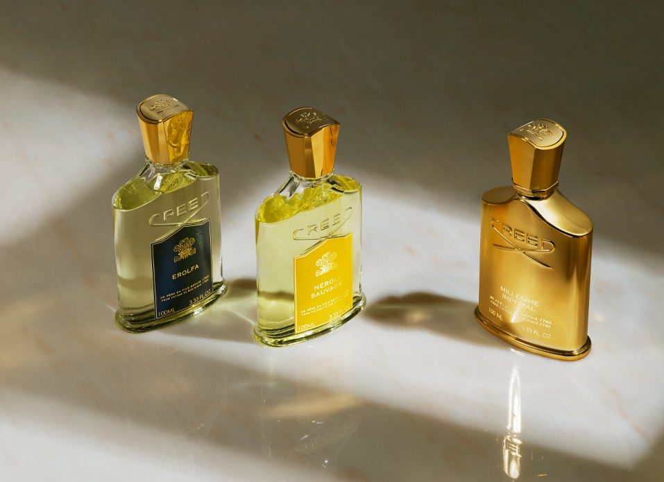 Erolfa, Neroli Sauvage & Millesime Imperial bottles on marble