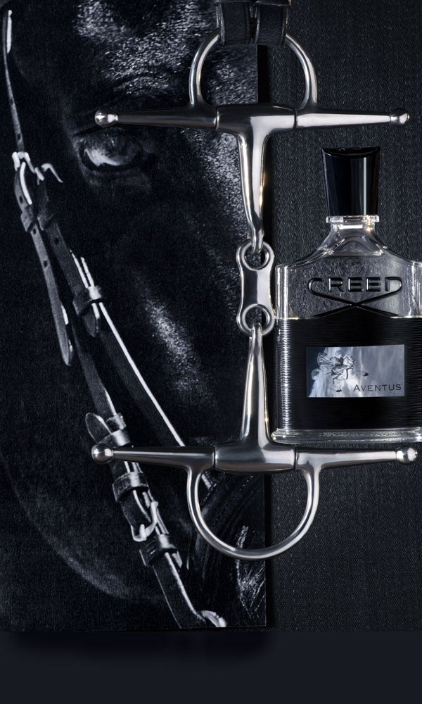 Close up of black horse, with a bottle of Aventus fragrance