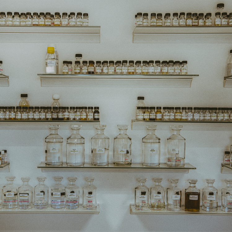 Fragrance bottles on shelves