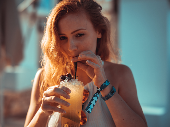 Woman drinking with a straw