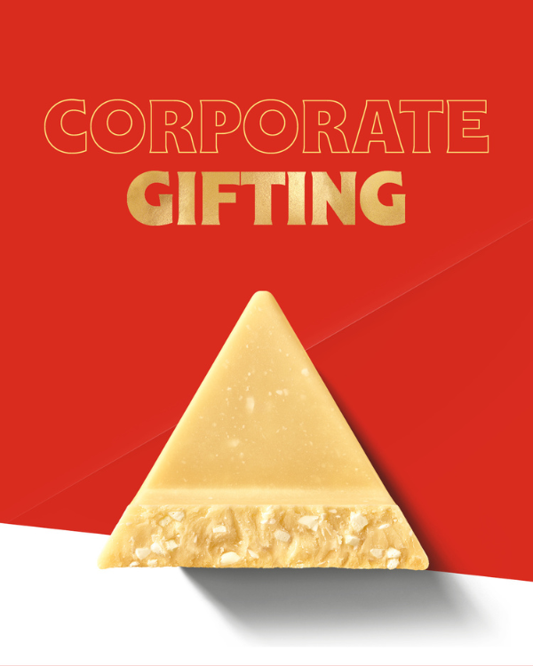 A Piece of Golden Toblerone on a red background. Title reads Coporate Gifting in Gold Lettering.
