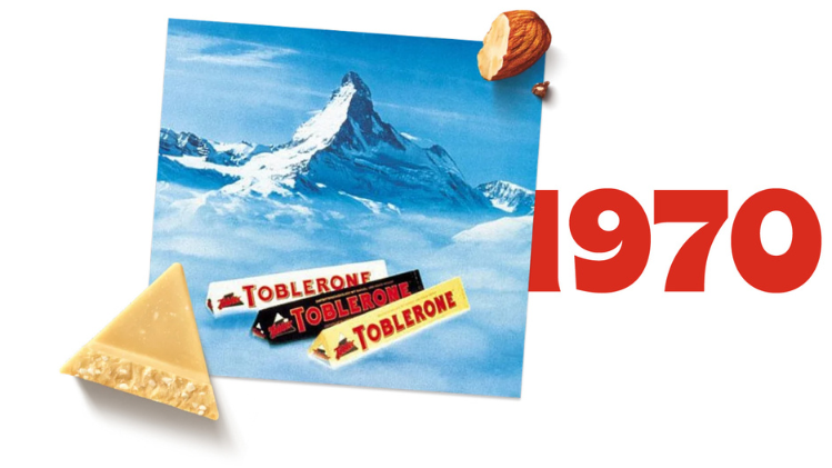 A picture of 3 bars of Toblerone with the year 1970 next to it in red.