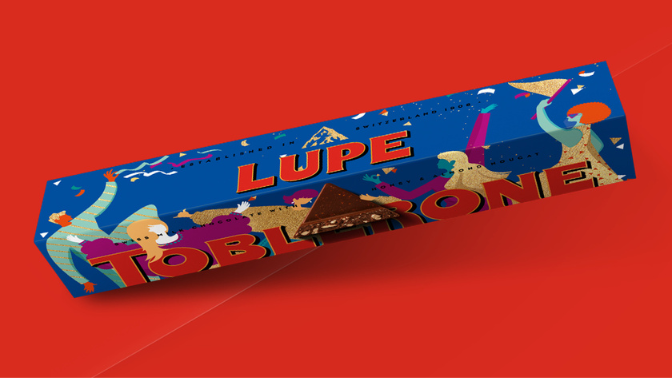 Blue packing personalised Toblerone bar with the name LUPE printed on the side.