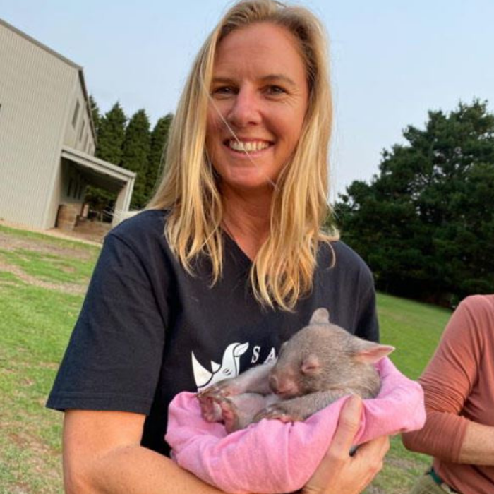 Jamie Jordan saving the wild holding an orphaned baby wombat. Project created by Comvita Manuka Honey.