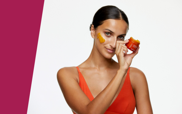 woman holding face mask