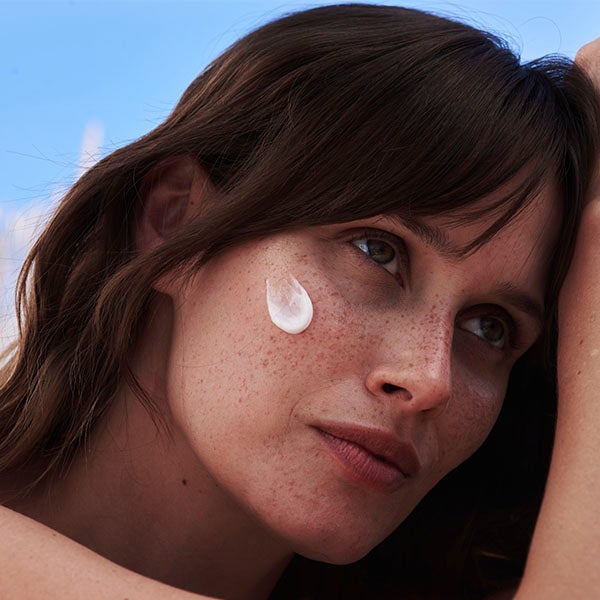 woman with cream on her face