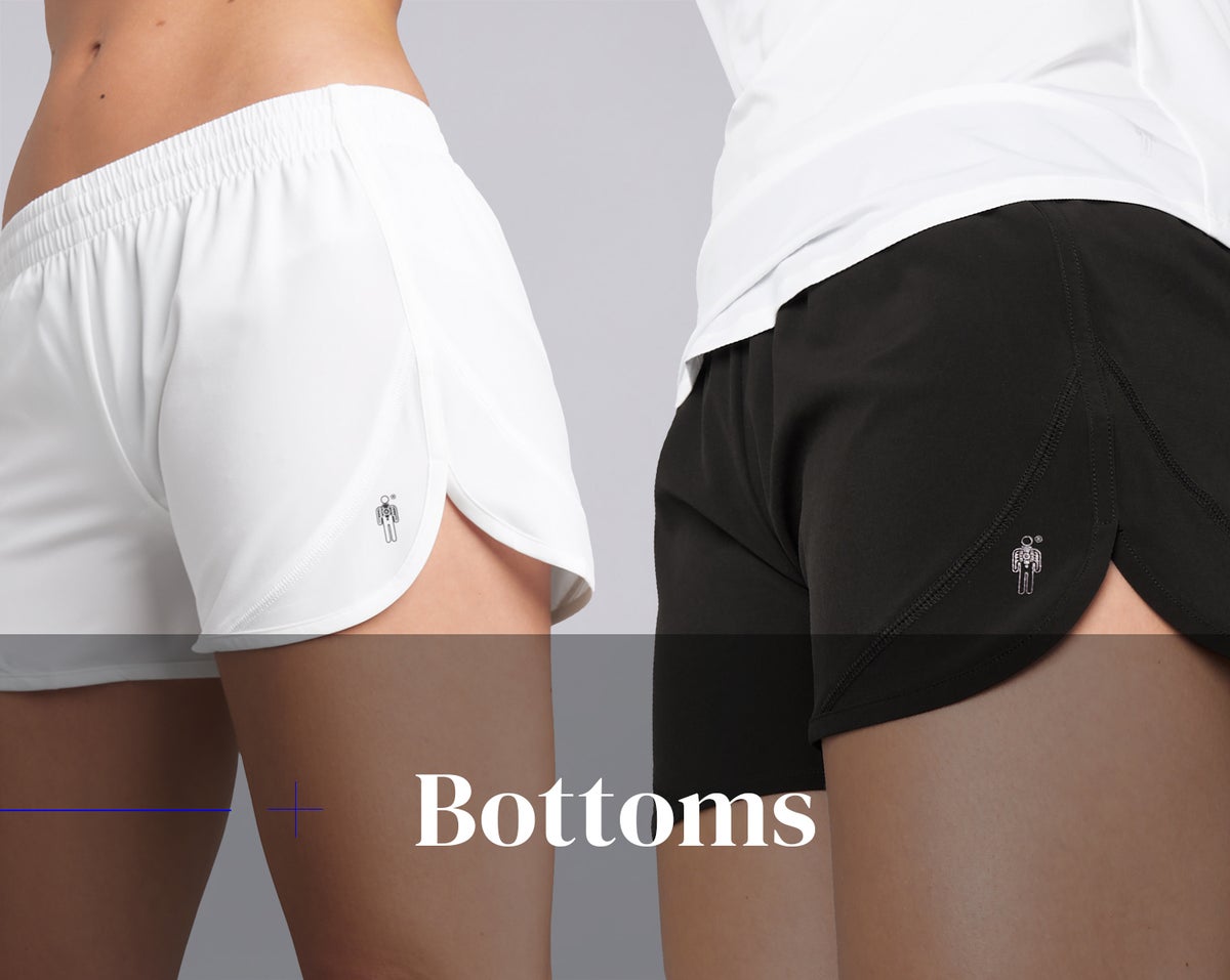 Bottoms for women. Two models wearing white and black shorts from HPE Activewear.