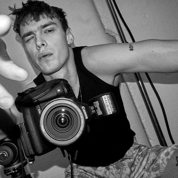 Les Boys, man holding camera