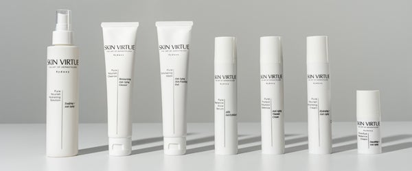 Model holding Skin Virtue Product