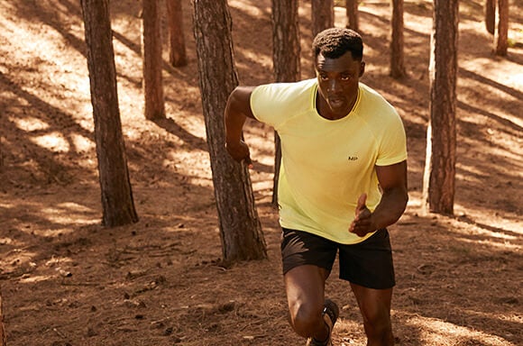 man running in forest