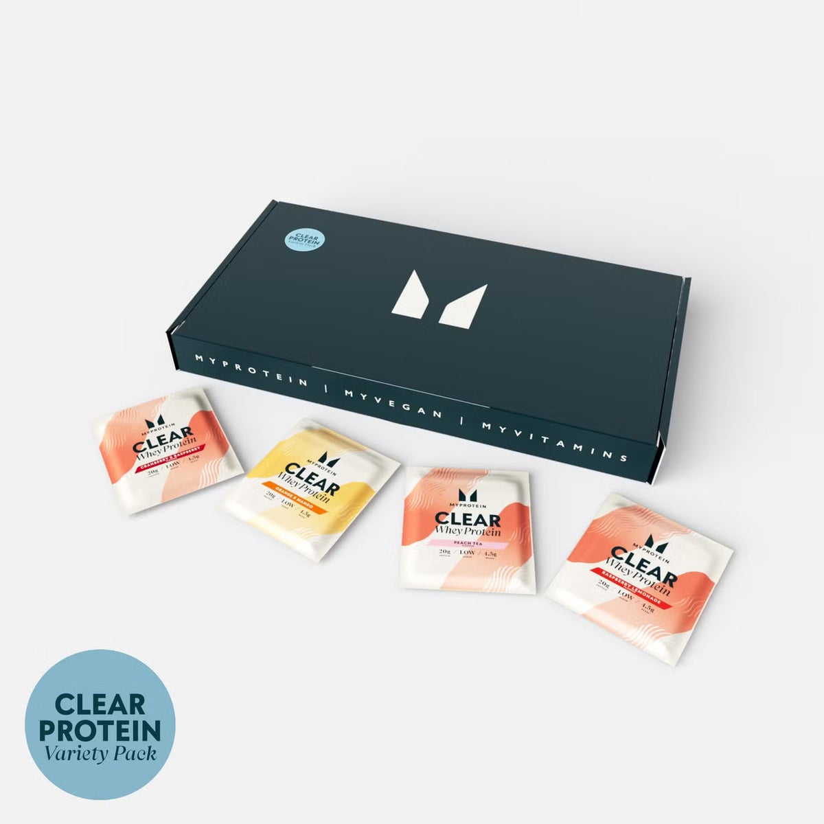 The clear whey variety pack on a podium showcasing various flavours including cranberry & raspberry and orange mango next to a Myprotein branded shaker.