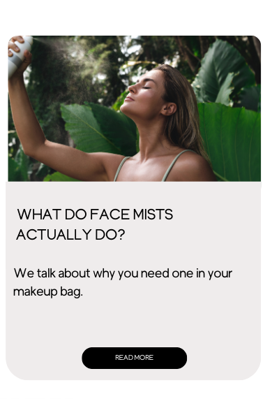 A woman spraying a facial mist.