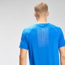 Camiseta de entrenamiento de manga corta con gráfico repetido para hombre de MP - Azul medio - XS