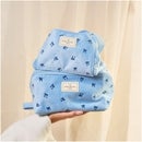 The Flat Lay Co. Drawstring Flat Lay Makeup Bag - Ditsy Bows Blue Embroidered Velvet