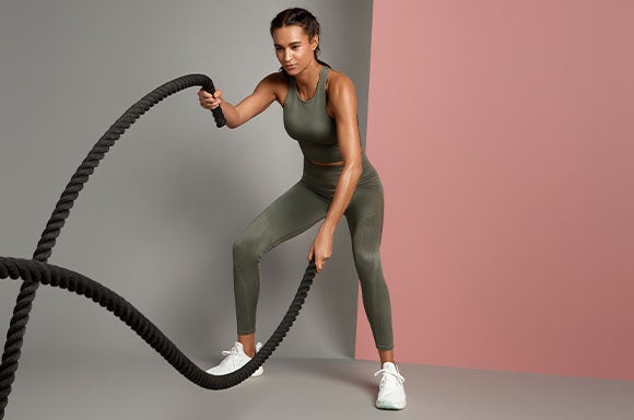 Woman with battle ropes