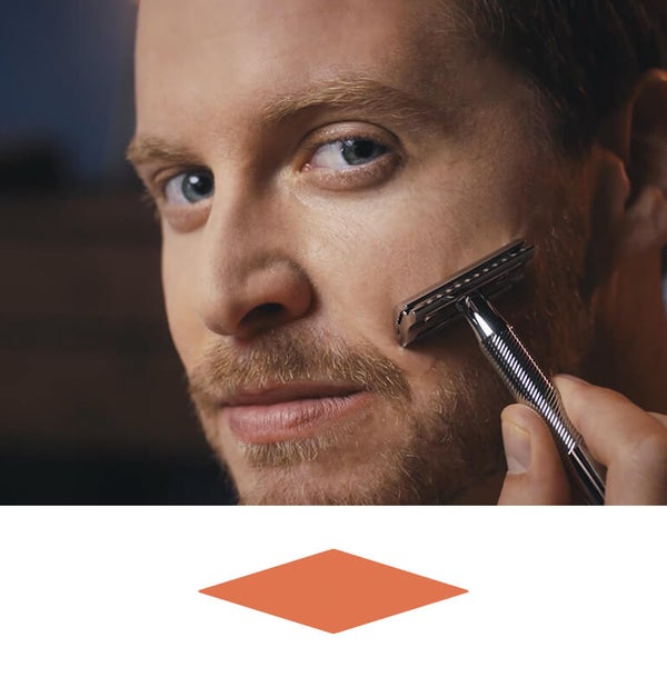 Man shaving beard with King C. Gillette Double Edge Eazor