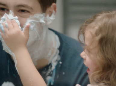 Man with Gillette Shaving Foam around face and child applying more to face | Gillette UK