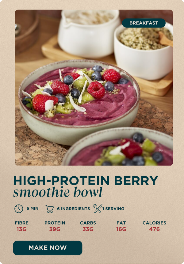 'High protein mixed berry smoothie bowl' Make now. Image is a close up of overnight oats with blueberries