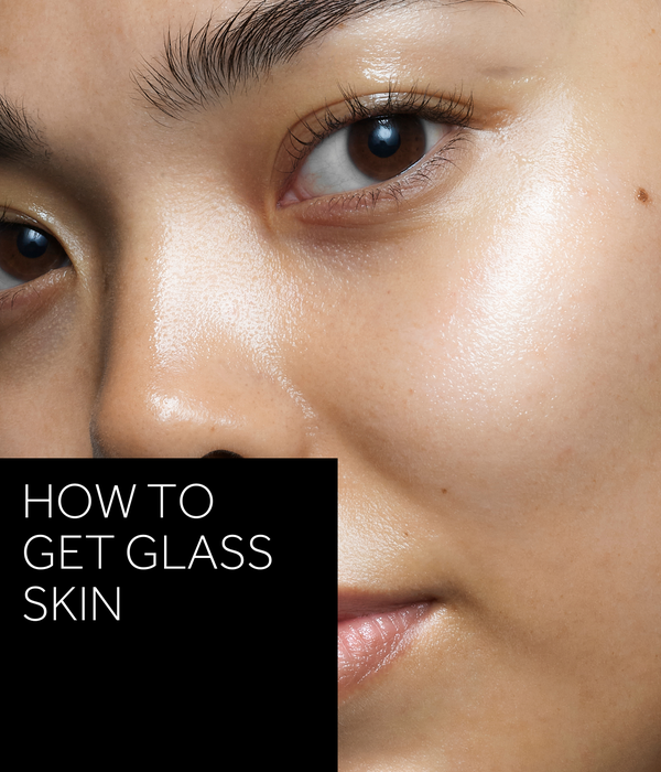 'How to get glass skin' text in white over black box. Image is close up model shot showing the glass skin look.