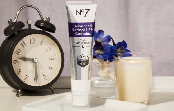 Tube of No7 Advanced Retinol 1.5% Complex Night Concentrate on white porcelain dish