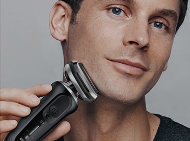 Braun - Get the most comfortable shave - Man using Series 7 electric shaver on his shaved face