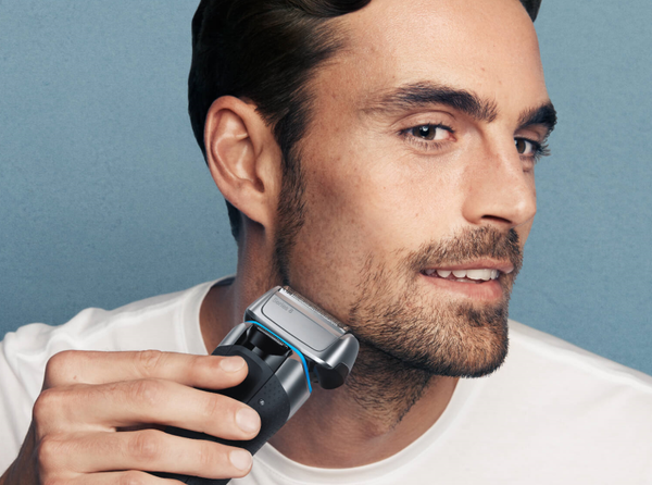 man with beard using a Series 8 electric shaver to take it off