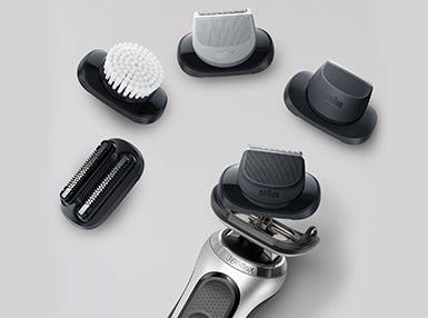 Both - Braun - Brau Series 7 electric shaver with Easy click attachments surrounding it