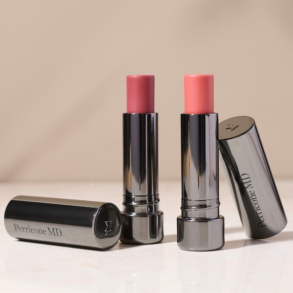 Image of a lipstick lying flat on a white background, with a swatch of the mauve pink shade.