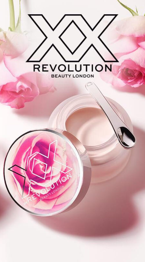 XX Revolution Beauty. Small open container among pink roses and a pink background.