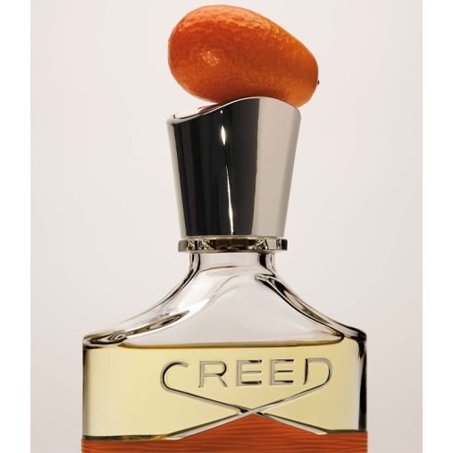 Orange on lid of fragrance bottle